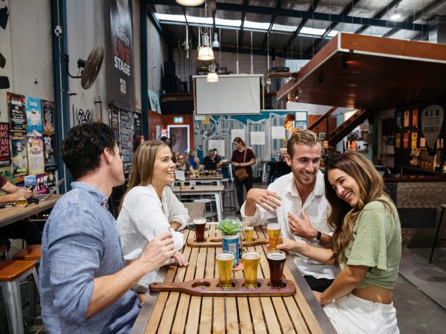 friends enjoying drinks at Six String Brewing Co. Erina
