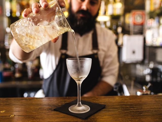a bartender preparing a drink at Bar Toto, Ettalong