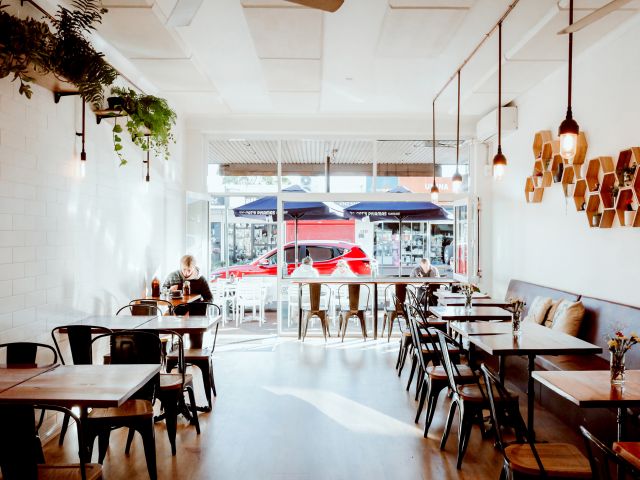 a person sitting inside Café Ronto, Umina