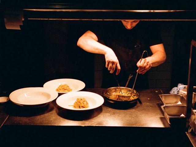 a chef preparing dishes at Giro Osteria, Cronulla