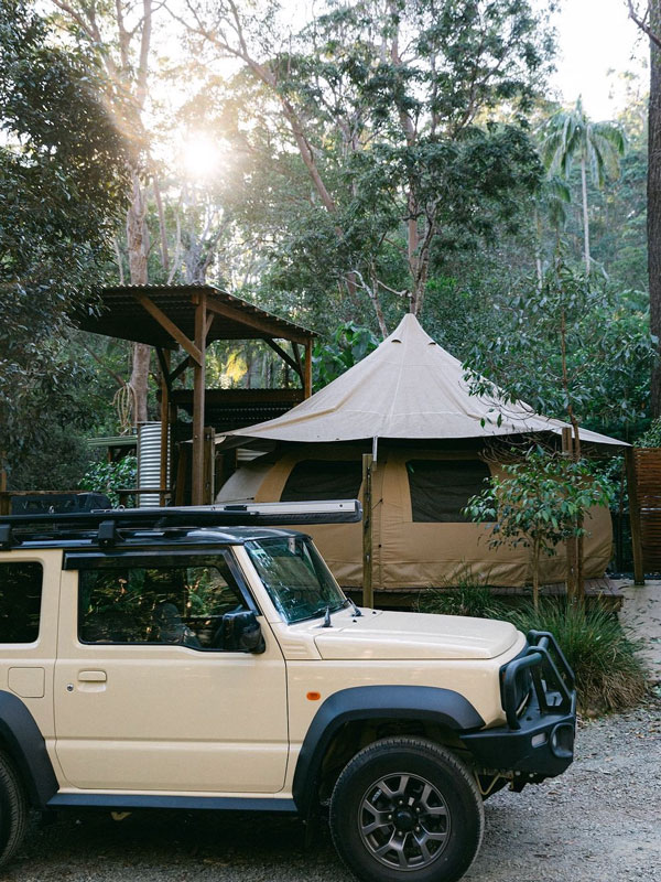 a 4WD outside the glamping tent at Tamborine Mountain Glades, Gold Coast