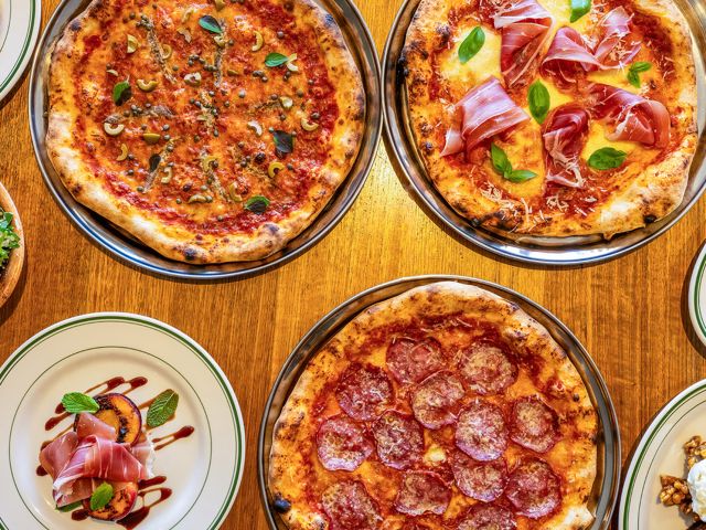 a variety of pizzas at Salonika Social Pizzeria