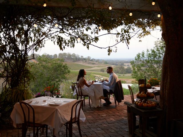 a couple dining among the vines at Bistro Molines, Hunter Valley