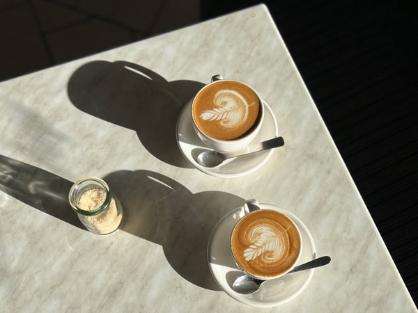 two cups of latte at Bills Beans East Orange cafe