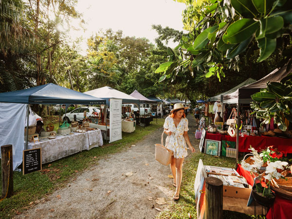 a woman browsing through the stalls at Mission Beach Markets