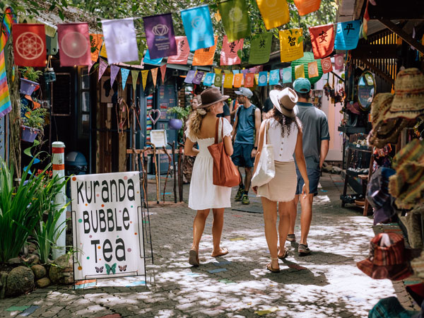 two women strolling along Kuranda Original Rainforest Markets