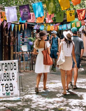 two women strolling along Kuranda Original Rainforest Markets