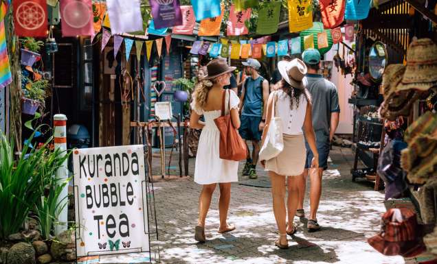 two women strolling along Kuranda Original Rainforest Markets