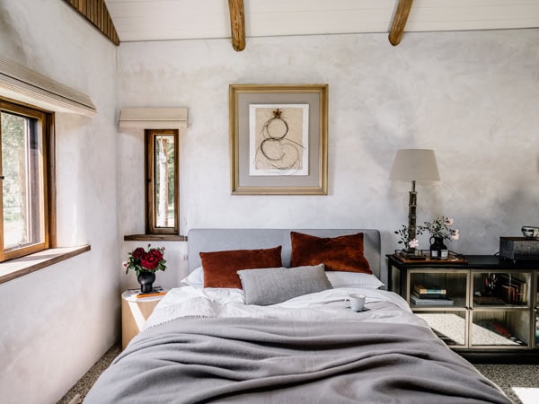 the whitewashed bedroom at Carl’s Hut at Solitude, Yarra Valley