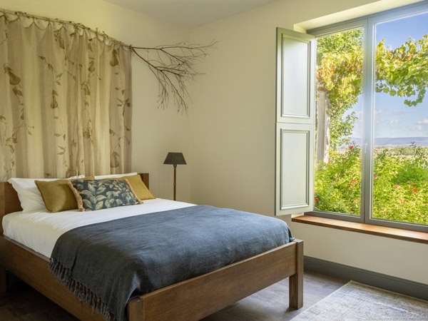 the bedroom at Farmhouse at Meletos with scenic views from the window