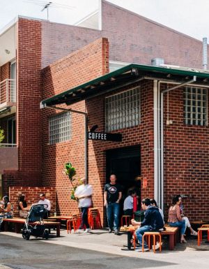 people sitting on al fresco chairs outside Community Coffee Co, Perth