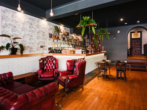 red leather couches at the vintage restaurant interior of Hairy Goat Tapas & Cocktails, Warrnambool