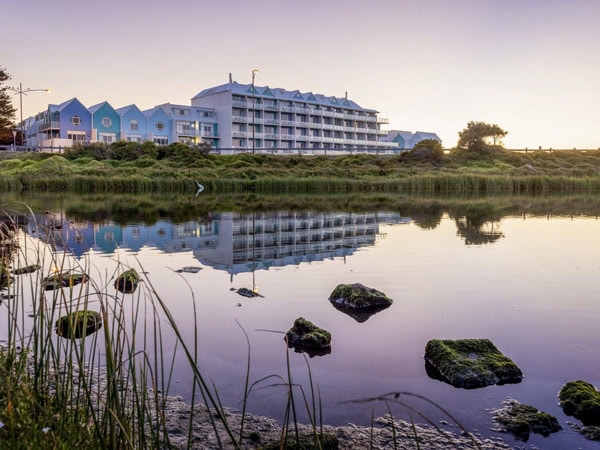 the exterior of Lady Bay Resort with water views