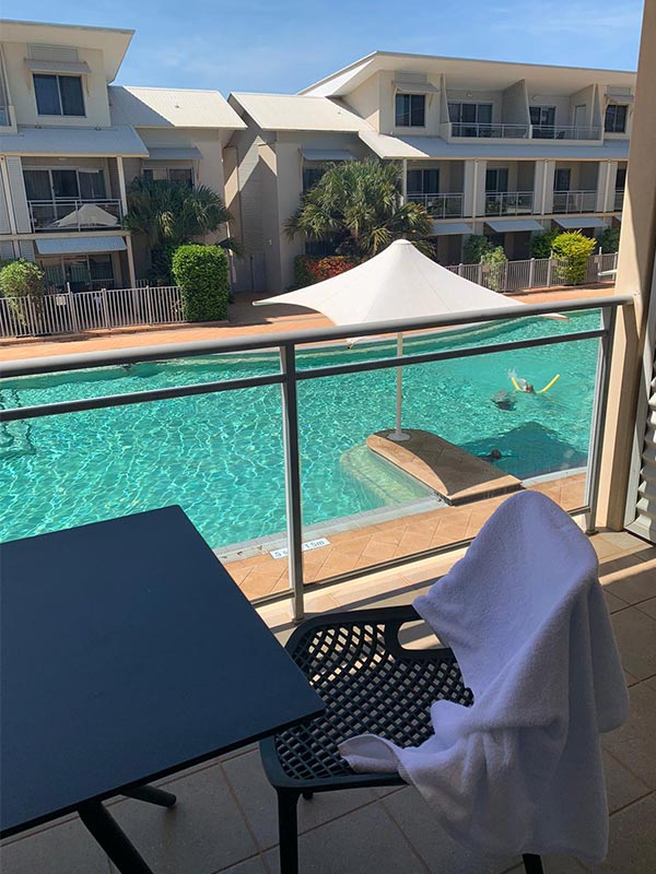 view of the pool from a room balcony at oaks broome