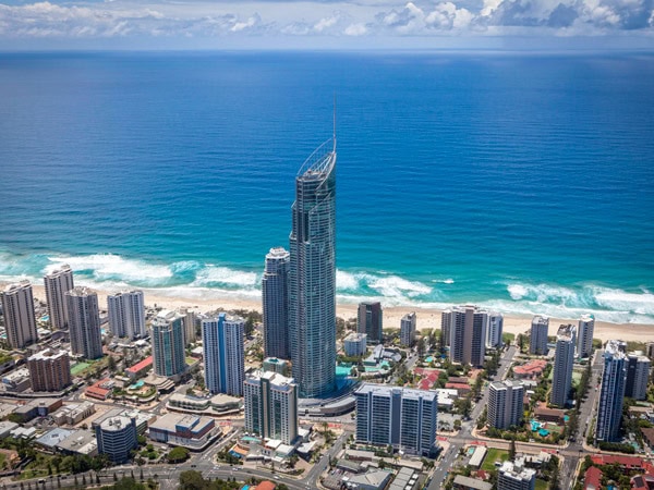 an aerial view of the buildings by the beach at Q1 Resort and Spa