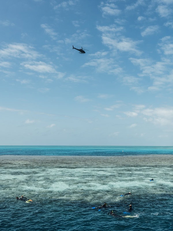 Helicopter above and People snorkelling at Reefworld