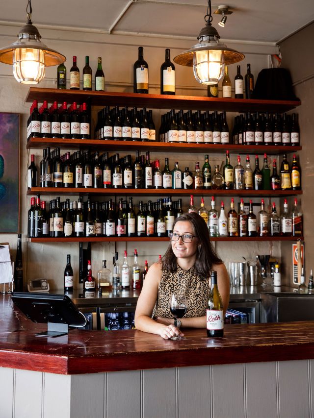 Dani Elred, owner of Roth's Wine Bar, Mudgee with a glass of Grapes of Roth Shiraz.