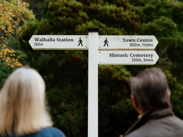 Couple look at signs in town at Walhalla