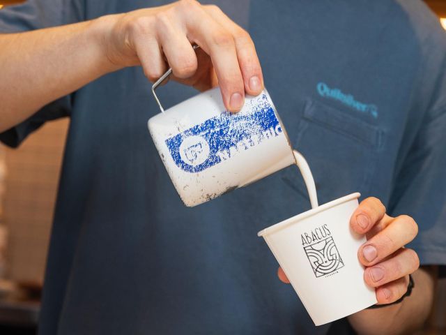 pouring milk into a cup at Abacus Espresso, Perth