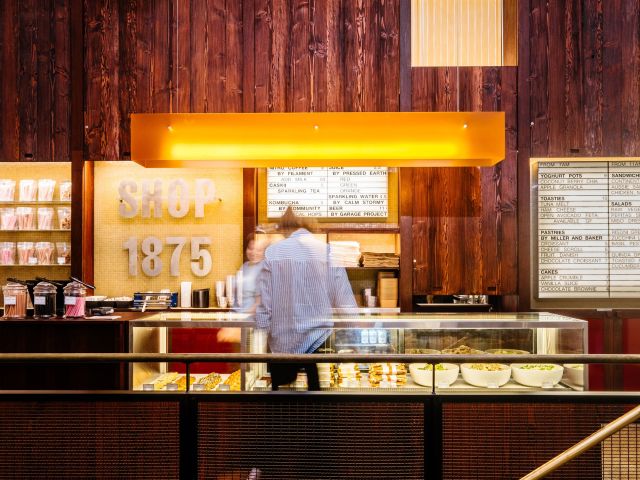 a person at the counter browsing the menu at SHOP 1875, Perth