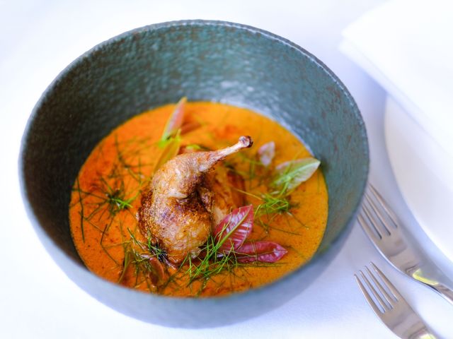 Paste Australia's delicious quail, lacquered with palm sugar and wild honey and served with Kanchanaburi red curry and sour leaves