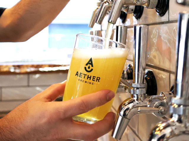 beer being poured from tap at Aether Brewing, Brisbane brewery