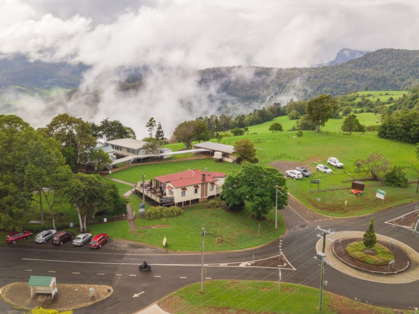 an aerial view of Beechmont Markets with a foggy mountain in the background