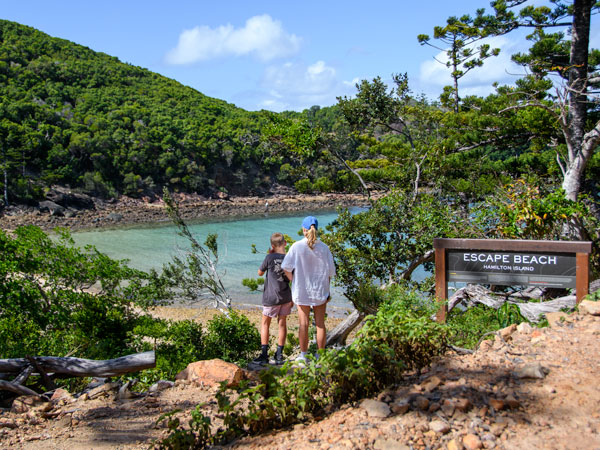 two people arriving at Escape Beach, Hamilton Island