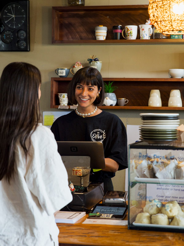 a customer ordering at The Olive Cafe, Norfolk Island