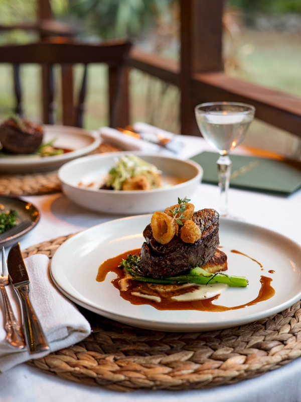 a close-up shot of a meat dish at The Homestead Restaurant, Norfolk Island