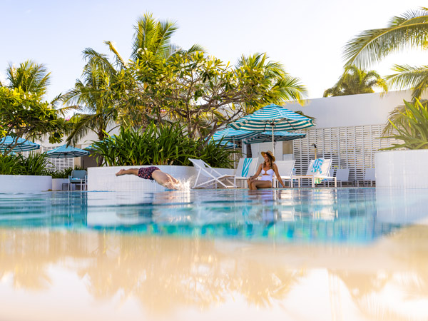 relaxing by the pool at The Ville, Townsville