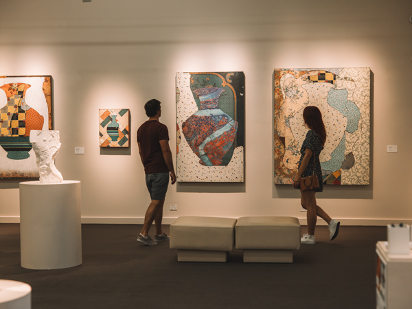 a couple admiring art at Perc Tucker Regional Gallery