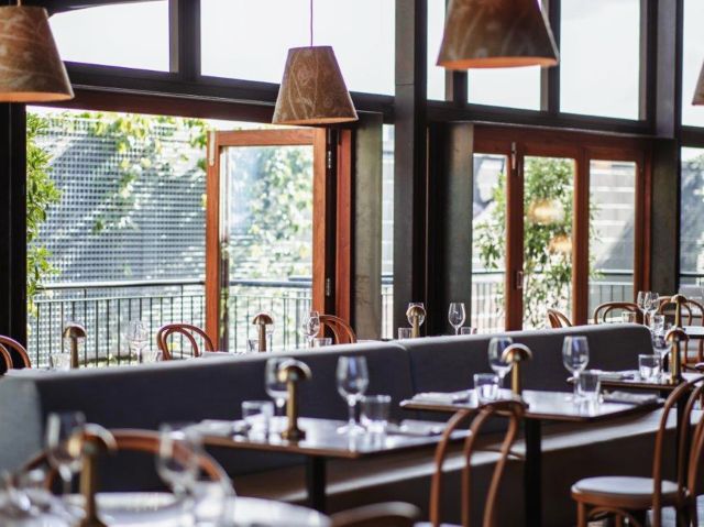 the airy and breezy Parisian-inspired dining interior at Herve’s Restaurant & Bar