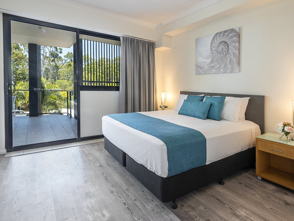 the bedroom at The Bay Apartments