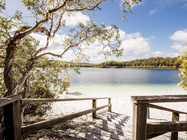 the boardwalk leading to an empty Lake McKenzie