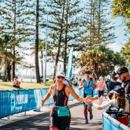 Woman running in the Mooloolaba Triathlon on the Sunshine Coast