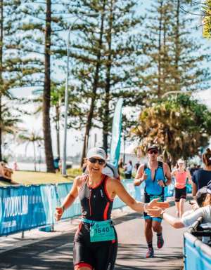 Woman running in the Mooloolaba Triathlon on the Sunshine Coast