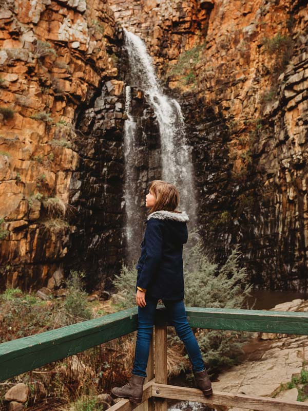 A girl at a waterfall in Morialta Conservation Park