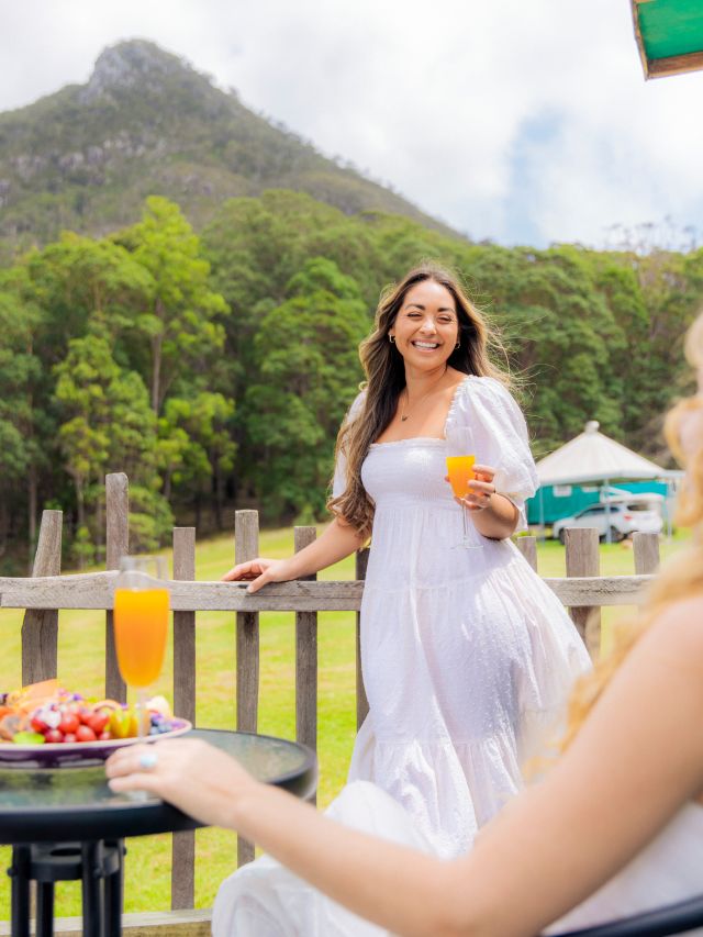 a woman holding a drink at Noosa Eco Retreat