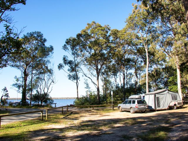 campers next to a lake at Boreen Point Campground