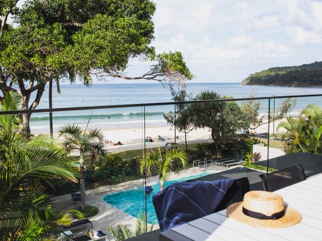 view of the pool and beach from the balcony of Seahaven Noosa