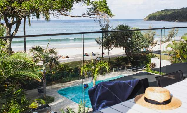 view of the pool and beach from the balcony of Seahaven Noosa