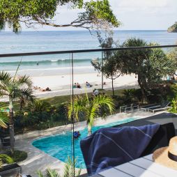 view of the pool and beach from the balcony of Seahaven Noosa