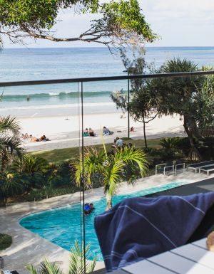 view of the pool and beach from the balcony of Seahaven Noosa