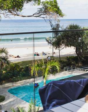 view of the pool and beach from the balcony of Seahaven Noosa