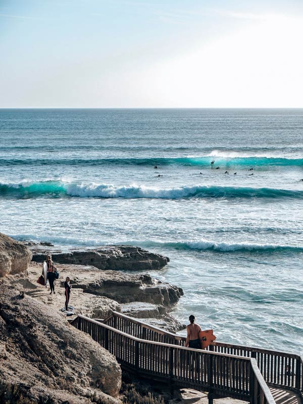 Surfers using the coastal walk at Port Noarlunga South 