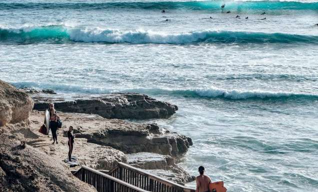 Surfers using the coastal walk at Port Noarlunga South