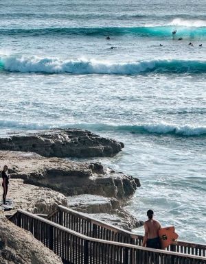 Surfers using the coastal walk at Port Noarlunga South