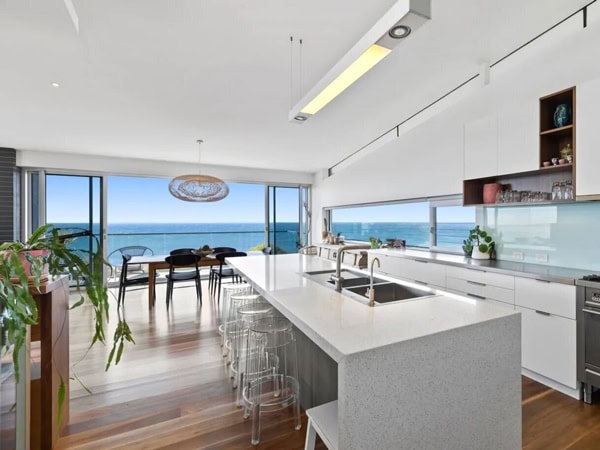 the interior of Vista 180 accommodation in Lorne with windows that open up to sea views