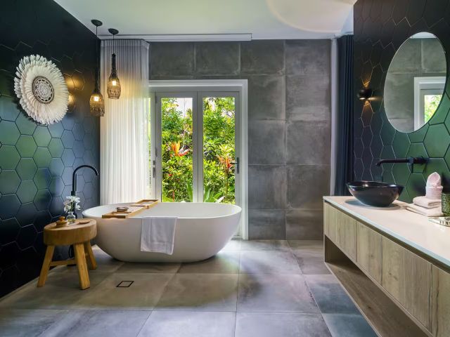a bathroom with a tub at The Langville Estate, Noosa